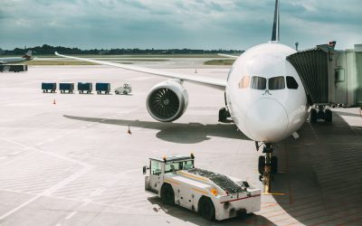 Aircraft Plane Boarding Passengers In Airport Terminal. Aircraft