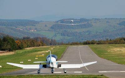 Small aircraft with mountains on the background